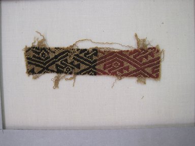 Coastal Wari. <em>Textile Fragment, undetermined</em>, 600–1400 C.E. Cotton, camelid fiber, 4 1/8 x 13/16in. (10.5 x 2cm). Brooklyn Museum, Gift of Adelaide Goan, 67.159.5. Creative Commons-BY (Photo: , CUR.67.159.5_view01.jpg)