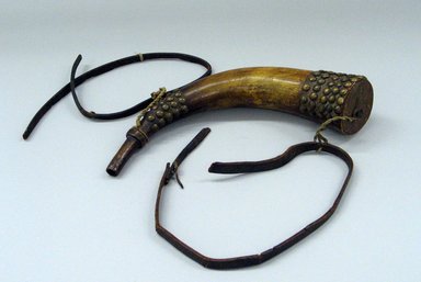 Eastern Woodlands; Weeden Island Culture. <em>Powder Horn and Shot Flask</em>, 1801-1900, 19th century. Brass, wood, bronze?, leather, fiber, lead, horn, a: (29.5 cm). Brooklyn Museum, Gift of Irving Rice, 67.241.2a-b. Creative Commons-BY (Photo: Brooklyn Museum, CUR.67.241.2a_view1.jpg)