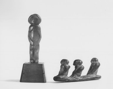 Chokwe. <em>Standing Figure for Divination Basket</em>, early 20th century. Patinated wood, 2 1/4 x 3/4 x 1/2 in. (5.7 x 1.7 x 1.3 cm). Brooklyn Museum, Bequest of Laura L. Barnes, 67.25.30. Creative Commons-BY (Photo: , CUR.67.25.30_67.25.31_print_bw.jpg)