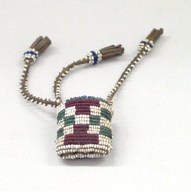 Possibly Sioux or. <em>Awl Case</em>, 1898-1902. Hide, beads, metal, sinew, 11 x 5 15/16 in. (27.9 x 15.1 cm). Brooklyn Museum, Gift of J.L. Greason, 67.26.17a-b. Creative Commons-BY (Photo: Brooklyn Museum, CUR.67.26.17a-b_detail.jpg)
