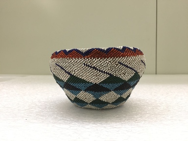Southwest (unidentified). <em>Beaded Basket</em>, late 19th - early 20th century. Fiber with beadwork, 3 1/4 × 5 1/2 × 5 5/8 in. (8.3 × 14 × 14.3 cm). Brooklyn Museum, Gift of J.L. Greason, 67.26.1. Creative Commons-BY (Photo: Brooklyn Museum, CUR.67.26.1_view01.jpg)