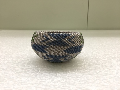Southwest (unidentified). <em>Beaded Basket</em>, late 19th - early 20th century. Fiber, beads, 2 1/4 × 3 7/8 × 3 3/4 in. (5.7 × 9.8 × 9.5 cm). Brooklyn Museum, Gift of J.L. Greason, 67.26.2. Creative Commons-BY (Photo: Brooklyn Museum, CUR.67.26.2_view01.jpg)