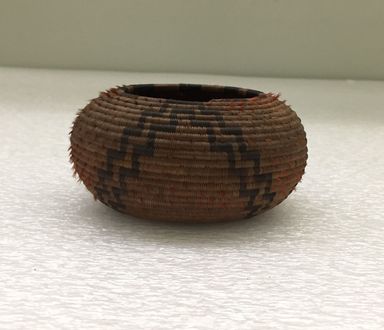 Pomo. <em>Basket</em>, late 19th - early 20th century. Bulrush, sedge root, redheaded woodpecker feathers, 2 1/8 × 2 1/2 × 2 1/2 in. (5.4 × 6.4 × 6.4 cm). Brooklyn Museum, Gift of J.L. Greason, 67.26.5. Creative Commons-BY (Photo: Brooklyn Museum, CUR.67.26.5_view01.jpg)