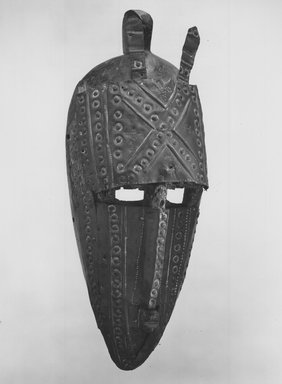 Marka. <em>Facial Mask, Marka Style</em>, late 19th-early 20th century. Wood, metal, 13 × 5 1/2 × 3 1/2 in. (33 × 14 × 8.9 cm). Brooklyn Museum, Gift of Rosemary and George Lois, 68.159.3. Creative Commons-BY (Photo: Brooklyn Museum, CUR.68.159.3_print_bw.jpg)