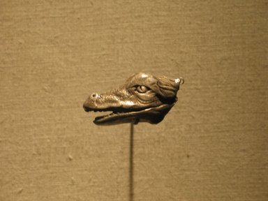 <em>Crocodile Head and Ibis</em>, 305-30 B.C.E. Silver, 13/16 x 9/16 x 1 9/16 in. (2 x 1.5 x 3.9 cm). Brooklyn Museum, Charles Edwin Wilbour Fund, 68.83.1. Creative Commons-BY (Photo: Brooklyn Museum, CUR.68.83.1_wwg8.jpg)