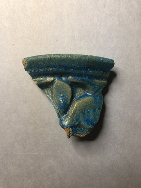  <em>Vessel Fragment</em>, 305 B.C.E.–395 C.E. Faience, 2 1/16 x 2 3/8 x 3/8 in. (5.2 x 6.1 x 1 cm). Brooklyn Museum, Anonymous gift, 69.112.13. Creative Commons-BY (Photo: , CUR.69.112.13_view01.jpg)