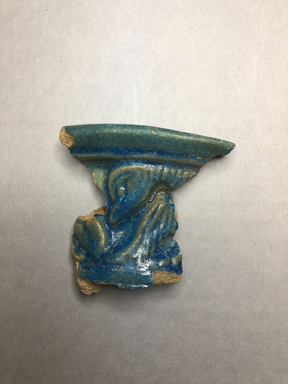  <em>Vessel Fragment</em>, 305 B.C.E.–395 C.E. Faience, 1 11/16 x 1 7/8 x 3/16 in. (4.3 x 4.8 x 0.5 cm). Brooklyn Museum, Anonymous gift, 69.112.15. Creative Commons-BY (Photo: , CUR.69.112.14_69.112.15_view01.jpg)