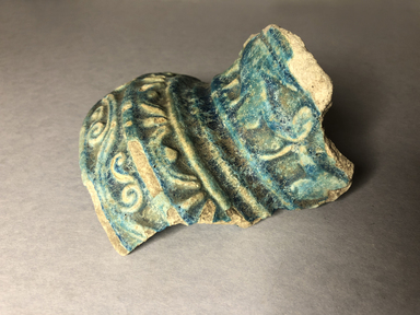  <em>Vessel Fragment</em>, 305 B.C.E.–395 C.E. Faience, 3 13/16 x 4 5/16 in. (9.7 x 11 cm). Brooklyn Museum, Anonymous gift, 69.112.23. Creative Commons-BY (Photo: , CUR.69.112.23_view03.jpg)