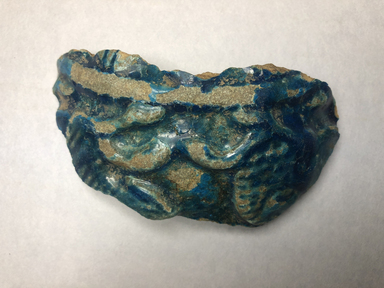 <em>Vessel Fragment</em>, 305 B.C.E.-395 C.E. Faience, 2 3/8 x 4 5/16 in. (6 x 11 cm). Brooklyn Museum, Anonymous gift, 69.112.24. Creative Commons-BY (Photo: , CUR.69.112.24_view01.jpg)