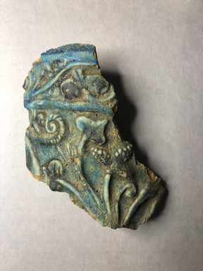  <em>Vessel Fragment</em>, 305 B.C.E.-395 C.E. Faience, 4 5/8 x 3 9/16 in. (11.7 x 9 cm). Brooklyn Museum, Anonymous gift, 69.112.25. Creative Commons-BY (Photo: , CUR.69.112.25_view01.jpg)