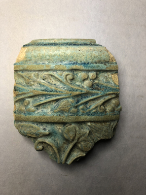  <em>Vessel Fragment</em>, 305 B.C.E.-395 C.E. Faience, 3 1/4 x 2 15/16 x 1/2 in. (8.3 x 7.5 x 1.2 cm). Brooklyn Museum, Anonymous gift, 69.112.28. Creative Commons-BY (Photo: , CUR.69.112.28_view01.jpg)