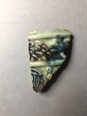  <em>Vessel Fragment</em>, 305 B.C.E.-395 C.E. Faience, 2 3/4 x 1 15/16 x 5/16 in. (7 x 5 x 0.8 cm). Brooklyn Museum, Anonymous gift, 69.112.33. Creative Commons-BY (Photo: , CUR.69.112.33_view01.jpg)