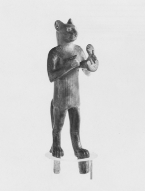 <em>Statuette of Re as a Standing Tomcat</em>, 305-30 B.C.E. Bronze, 5 7/8 x 2 1/4 in. (14.9 x 5.7 cm). Brooklyn Museum, Charles Edwin Wilbour Fund, 69.113. Creative Commons-BY (Photo: , CUR.69.113_NegF_print_bw.jpg)
