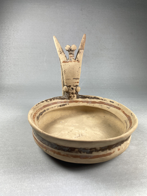 Apulian. <em>Shallow Bowl</em>, 6th-5th century B.C.E. Clay, slip, 5 11/16 × 1 5/8 × 6 1/8 in. (14.4 × 4.1 × 15.5 cm). Brooklyn Museum, Gift of Ernest Kofler, 70.131. Creative Commons-BY (Photo: Brooklyn Museum, CUR.70.131_view01.jpg)