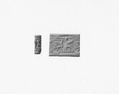Ancient Near Eastern. <em>Cylinder Seal</em>, 8th century B.C.E. Stone, glaze, 1 1/16 x Diam. 3/8 in. (2.7 x 1 cm). Brooklyn Museum, Twentieth-Century Fox Fund, 71.115.8. Creative Commons-BY (Photo: Brooklyn Museum, CUR.71.115.8_NegA_print_bw.jpg)