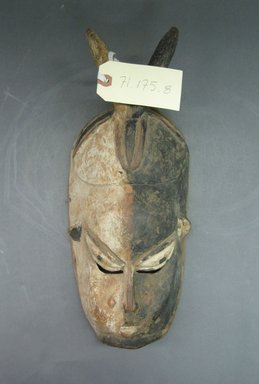 Edo. <em>Face Mask with Two Horns</em>, late 19th or early 20th century. Wood, pigment, metal, 15 x 6 1/2 x 3 1/2 in. (38.3 x 16.4 x 9.0 cm). Brooklyn Museum, Gift of Mr. and Mrs. Joseph Gerofsky, 71.175.8. Creative Commons-BY (Photo: Brooklyn Museum, CUR.71.175.8_front.jpg)