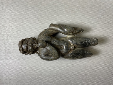  <em>Figure of Harpocrates</em>. Steatite, 6 5/16 × 3 1/4 × 1 11/16 in. (16 × 8.3 × 4.3 cm). Brooklyn Museum, Charles Edwin Wilbour Fund, 71.41. Creative Commons-BY (Photo: Brooklyn Museum, CUR.71.41_view01.jpg)