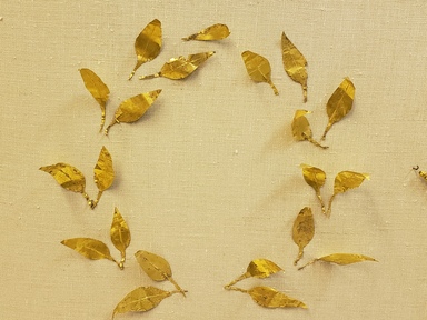 Greek. <em>Laurel Leaves Probably from a Wreath</em>, late 4th century B.C.E. Gold, 11/16 x 1 3/4 in. (1.7 x 4.5 cm). Brooklyn Museum, Gift of Mr. and Mrs. Thomas S. Brush, 71.79.128. Creative Commons-BY (Photo: Brooklyn Museum, CUR.71.79.119-.139_overall.jpg)