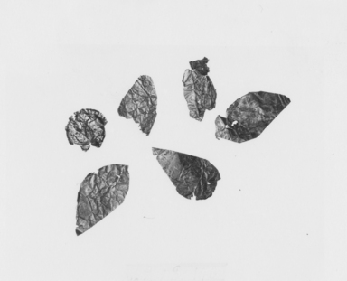 Greek. <em>Fragment of a Leaf</em>, late 4th century B.C.E. Gold, 9/16 x 13/16 in. (1.4 x 2.1 cm). Brooklyn Museum, Gift of Mr. and Mrs. Thomas S. Brush, 71.79.145. Creative Commons-BY (Photo: , CUR.71.79.140_.141_.142_.143_.144_.145_NegID_71.79.140-.145_GRPA_print_bw.jpg)