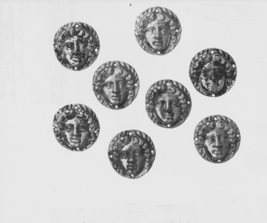 Greek. <em>Applique, Circular in Shape, with Female Face</em>, late 4th century B.C.E. Gold, 1/8 x 5/8 in. (0.3 x 1.6 cm). Brooklyn Museum, Gift of Mr. and Mrs. Thomas S. Brush, 71.79.177. Creative Commons-BY (Photo: , CUR.71.79.172_.173_.174_.175_.176_.177_.178_.179_NegID_71.79.172-.179_GRPA_print_bw.jpg)