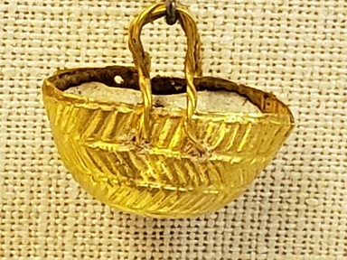 Greek. <em>Small Basket with Twisted Loop Handle</em>, late 4th century B.C.E. Gold, 3/4 x 1/2 x 13/16 in. (1.9 x 1.2 x 2.1 cm). Brooklyn Museum, Gift of Mr. and Mrs. Thomas S. Brush, 71.79.180. Creative Commons-BY (Photo: Brooklyn Museum, CUR.71.79.180_overall01.jpg)
