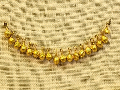 Hellenistic. <em>Hollow Bead</em>, late 4th century B.C.E. Gold, 3/8 x 3/16 in. (1 x 0.5 cm). Brooklyn Museum, Gift of Mr. and Mrs. Thomas S. Brush, 71.79.94. Creative Commons-BY (Photo: Brooklyn Museum, CUR.71.79.77-.94_overall01.jpg)
