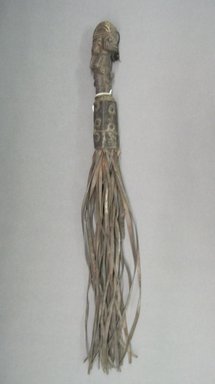 Yorùbá. <em>Fly Whisk with Standing Male Figure</em>, late 19th or early 20th century. Leather, copper alloy, 5 1/4 x 22 1/2 in. (13.3 x 52.2 cm). Brooklyn Museum, Gift of Dr. and Mrs. Abbott A. Lippman to the Jennie Simpson Educational Collection of African Art, 72.172.5. Creative Commons-BY (Photo: Brooklyn Museum, CUR.72.172.5.jpg)