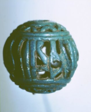  <em>Openwork Bead of Circular Form</em>. Faience, 1 3/8 in. (3.5 cm). Brooklyn Museum, Charles Edwin Wilbour Fund, 73.87.2. Creative Commons-BY (Photo: Brooklyn Museum, CUR.73.87.2.jpg)