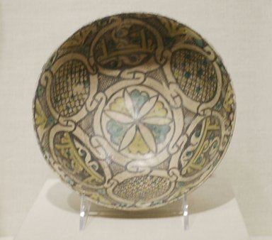  <em>Bowl with Blessings</em>, 10th century. Ceramic; earthenware, painted in black slip and green and yellow pigments under a transparent glaze, 2 13/16 x 7 1/2 in. (7.1 x 19.1 cm). Brooklyn Museum, Gift of Mr. and Mrs. Charles K. Wilkinson, 73.94.3. Creative Commons-BY (Photo: Brooklyn Museum, CUR.73.94.3.jpg)