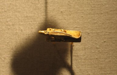  <em>Ring with Image of a Crocodile</em>, ca. 1539-1075 B.C.E. or later. Gold, 1 × 1 3/16 in. (2.5 × 3 cm). Brooklyn Museum, Charles Edwin Wilbour Fund, 74.21. Creative Commons-BY (Photo: Brooklyn Museum, CUR.74.21_wwg8.jpg)