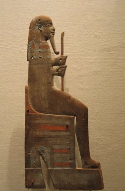  <em>Appliqué of a Seated God</em>, ca. 945–525 B.C.E. Wood, pigment, 11 5/8 × 5 1/4 × 2 3/4 in. (29.5 × 13.4 × 7 cm). Brooklyn Museum, Charles Edwin Wilbour Fund, 74.22. Creative Commons-BY (Photo: Brooklyn Museum, CUR.74.22_wwg8.jpg)