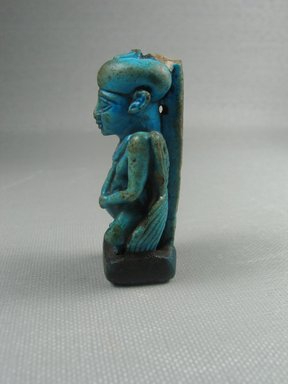 Nubian. <em>Figure of the God Pataikos</em>, ca. 716 B.C.E. Faience, 2 5/16 x 1 1/16 x 7/8 in. (5.9 x 2.7 x 2.3 cm). Brooklyn Museum, Charles Edwin Wilbour Fund, 75.166. Creative Commons-BY (Photo: Brooklyn Museum, CUR.75.166_view3.jpg)