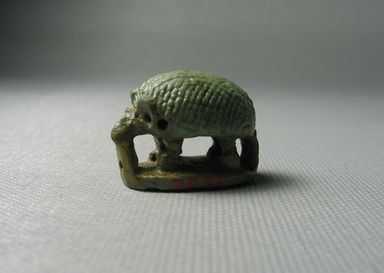  <em>Seal in the Form of a Standing Hedgehog Over a Base</em>, 664–332 B.C.E. Faience, 13/16 x 5/8 x 1 1/16 in. (2.1 x 1.6 x 2.7 cm). Brooklyn Museum, Gift of Jean-Louis Domercq, 75.25. Creative Commons-BY (Photo: Brooklyn Museum, CUR.75.25_view01.jpg)