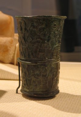  <em>Beaker (Repoussé Relief Decoration in Two Registers)</em>, early 2nd millennium B.C.E. Tin Bronze, 4 7/16 x 3 3/8 x 3 in. (11.3 x 8.6 x 7.6 cm). Brooklyn Museum, Gift of Mr. and Mrs. Paul Manheim, 75.29. Creative Commons-BY (Photo: Brooklyn Museum, CUR.75.29_kevorkian_03_09.jpg)
