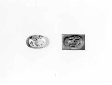Ancient Near Eastern. <em>Stamp Seal: Recumbent Stag with Plant</em>, 3rd-7th century C.E. Agate, 5/8 x 7/16 x 11/16 in. (1.6 x 1.1 x 1.7 cm). Brooklyn Museum, Designated Purchase Fund, 75.55.11. Creative Commons-BY (Photo: Brooklyn Museum, CUR.75.55.11_negA_bw.jpg)