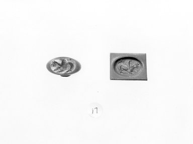 Ancient Near Eastern. <em>Stamp Seal: Recumbent Griffin</em>, 3rd-7th century C.E. Chalcedony, 9/16 x 3/8 x 9/16 in. (1.4 x 0.9 x 1.4 cm). Brooklyn Museum, Designated Purchase Fund, 75.55.17. Creative Commons-BY (Photo: Brooklyn Museum, CUR.75.55.17_negA_bw.jpg)