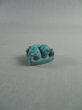  <em>Double Crocodile Amulet</em>, 664-343 B.C.E. Faience, 9/16 x 11/16 x 7/8 in. (1.4 x 1.7 x 2.3 cm). Brooklyn Museum, Gift of Peter Sharrer, 76.37. Creative Commons-BY (Photo: Brooklyn Museum, CUR.76.37_View1.jpg)
