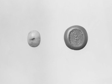 Ancient Near Eastern. <em>Stamp Seal: Male Figure Seated on a Lotus</em>, 7th-6th century B.C.E. Quartzite, 3/16 x 9 13/16 x 1/2 in. (0.5 x 25 x 1.3 cm). Brooklyn Museum, Special Middle Eastern Art Fund, 77.133. Creative Commons-BY (Photo: Brooklyn Museum, CUR.77.133_NegA_print_bw.jpg)