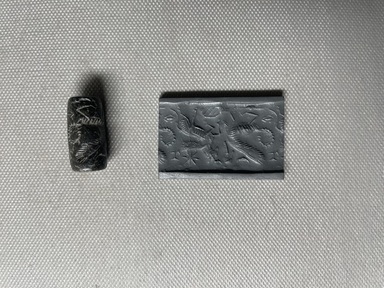 Ancient Near Eastern. <em>Cylinder Seal</em>, 1000-730 B.C.E. Stone, Diam. 1/2 x 1 in. (1.2 x 2.6 cm). Brooklyn Museum, Special Middle Eastern Art Fund, 77.7. Creative Commons-BY (Photo: Brooklyn Museum, CUR.77.7_overall01.jpeg)