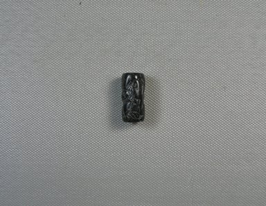 Ancient Near Eastern. <em>Cylinder Seal</em>, 1000-730 B.C.E. Stone, Diam. 1/2 x 1 in. (1.2 x 2.6 cm). Brooklyn Museum, Special Middle Eastern Art Fund, 77.7. Creative Commons-BY (Photo: Brooklyn Museum, CUR.77.7_view1.jpg)