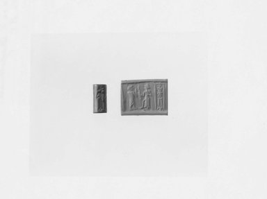 Ancient Near Eastern. <em>Cylinder Seal Depicting a Worshipper before Shamash with Raised Sword</em>, 1900-1650 B.C.E. Hematite (?), 3/4 x Diam. 3/8 in. (1.9 x 0.9 cm). Brooklyn Museum, Gift of Dr. Martin Cherkasky, 78.113.2. Creative Commons-BY (Photo: Brooklyn Museum, CUR.78.113.2_NegA_print_bw.jpg)