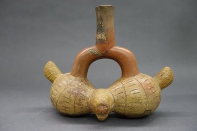 Late Cupisnique. <em>Stirrup Spout Vessel</em>, 800-500 B.C.E. Ceramic, red slip, 6 1/2 x 8 3/4 x 3 1/4 in. (16.5 x 22.2 x 8.3 cm). Brooklyn Museum, Gift of Mr. and Mrs. Paul B. Taylor, 78.118.41. Creative Commons-BY (Photo: , CUR.78.118.41_view01.jpg)