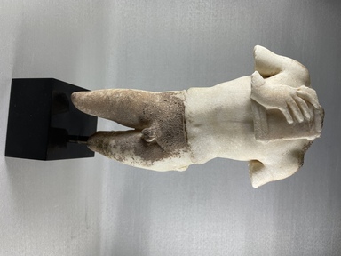 Roman. <em>Torso of a Youth playing a Pan Pipe</em>, 30 B.C.E.-395 C.E. Marble, 11 5/8 × 6 1/8 × 3 15/16 in. (29.5 × 15.5 × 10 cm). Brooklyn Museum, Gift of Julius J. Ivanitsky, 78.132. Creative Commons-BY (Photo: Brooklyn Museum, CUR.78.132_view01.jpg)