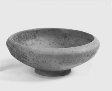  <em>Conical Bowl</em>, 305-30 B.C.E. Clay, slip, 1 3/4 x 5 1/8 in. (4.5 x 13 cm). Brooklyn Museum, Gift of the Egyptian Antiquities Organization, 80.7.2. Creative Commons-BY (Photo: Brooklyn Museum, CUR.80.7.2_NegA_print_bw.jpg)