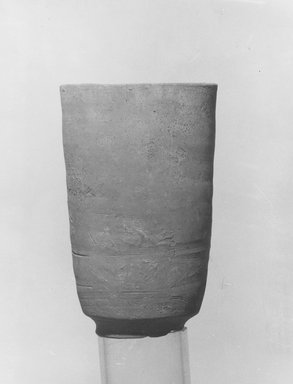  <em>Beaker</em>, 305-30 B.C.E. Clay, 4 x 2 1/2 in. (10.2 x 6.4 cm). Brooklyn Museum, Gift of the Egyptian Antiquities Organization, 80.7.8. Creative Commons-BY (Photo: Brooklyn Museum, CUR.80.7.8_NegL889_2A_print_bw.jpg)