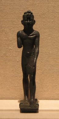 Egyptian. <em>Striding Figure of a Kushite King</em>, ca. 712–653 B.C.E. Bronze, 4 13/16 x 1 1/8 x 1 3/4 in. (12.2 x 2.8 x 4.5 cm). Brooklyn Museum, Charles Edwin Wilbour Fund, 81.184. Creative Commons-BY (Photo: Brooklyn Museum, CUR.81.184_wwg8.jpg)