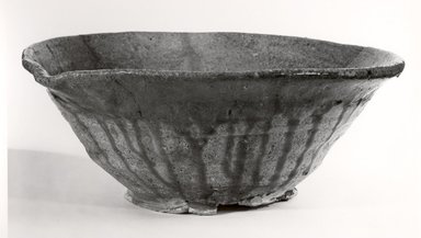  <em>Lipped Bowl</em>, late 12th-early 13th century. Stoneware with ash glaze; Tokoname ware, 4 3/4 x 12 1/4 in. (12.1 x 31.1 cm). Brooklyn Museum, Gift of Dr. John P. Lyden, 81.296.11. Creative Commons-BY (Photo: Brooklyn Museum, CUR.81.296.11_bw.jpg)