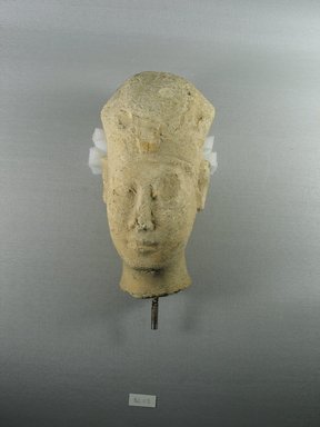  <em>Head of a King</em>, ca. 300–200 B.C.E. Limestone, 7 3/8 x 3 3/4 x 3 7/8 in. (18.8 x 9.5 x 9.8 cm). Brooklyn Museum, Gift of Beatrice Kelekian in memory of Charles D. Kelekian and in honor of Bernard V. Bothmer, 82.115. Creative Commons-BY (Photo: Brooklyn Museum, CUR.82.115_view1.jpg)