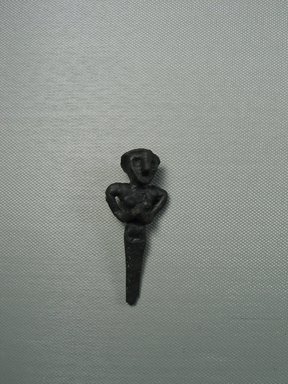 Syro-Lebanese. <em>Standing Female Figure</em>, 2000-1500 B.C.E. Copper, silver, 2 13/16 x 1 1/8 in. (7.1 x 2.9 cm). Brooklyn Museum, Gift of Jonathan P. Rosen, 82.116.15. Creative Commons-BY (Photo: Brooklyn Museum, CUR.82.116.15_view1.jpg)