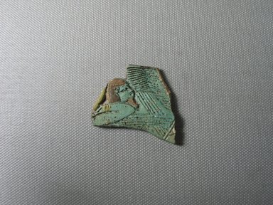 Egyptian. <em>Fragment of Cosmetic Spoon</em>, ca. 1400–1300 B.C.E. Faience, 1 7/8 × 1 3/4 × 1/4 in. (4.7 × 4.4 × 0.6 cm). Brooklyn Museum, Gift of Peter Sharrer, 82.170.1. Creative Commons-BY (Photo: , CUR.82.170.1_view01.jpg)